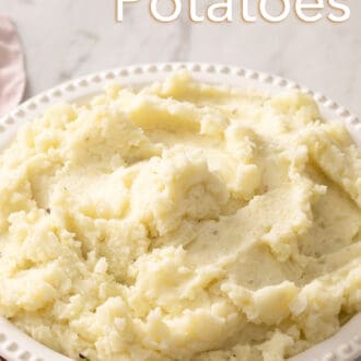 Pinterest graphic of mashed potatoes in a bowl with no toppings.