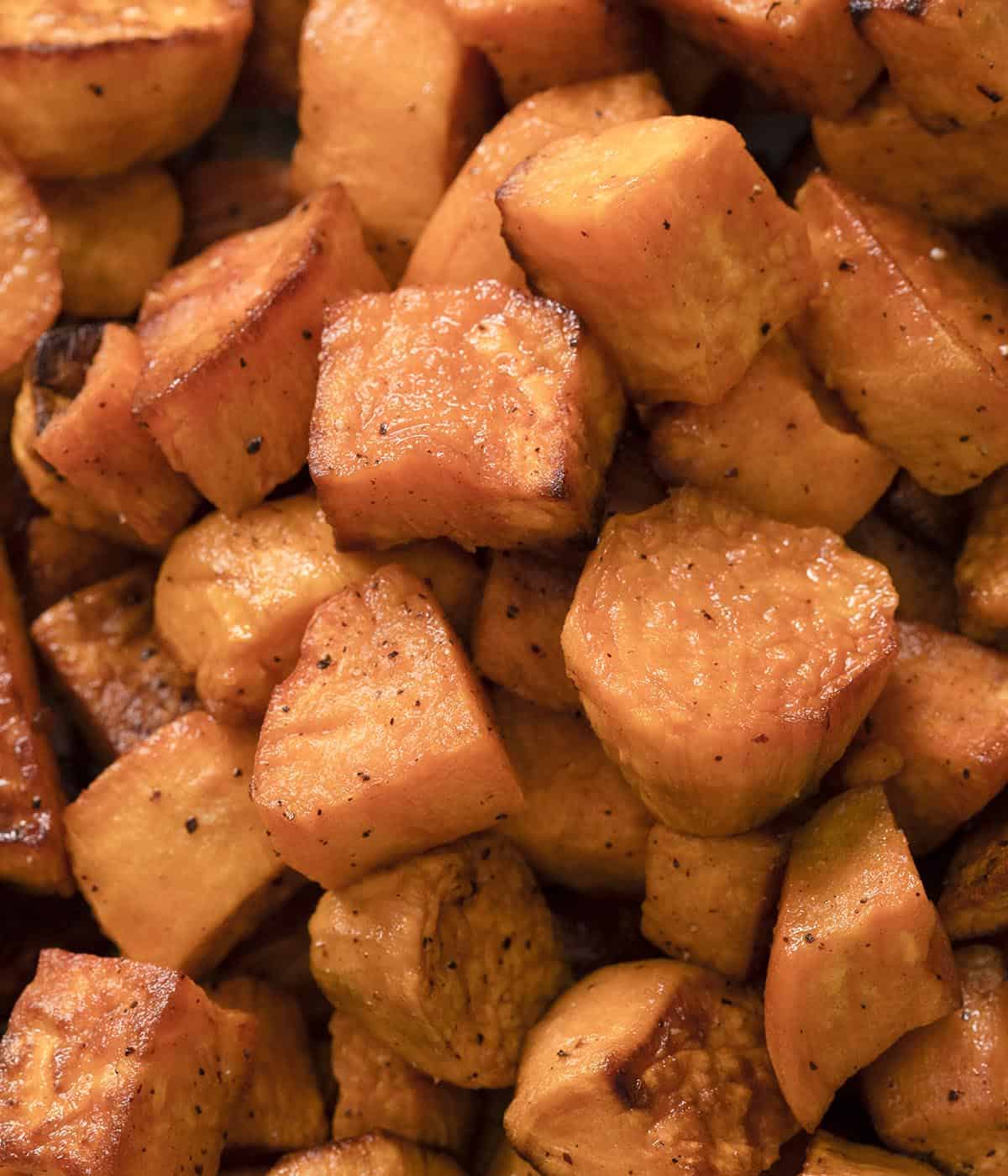 A close up photo of a group of roasted sweet potatoes.