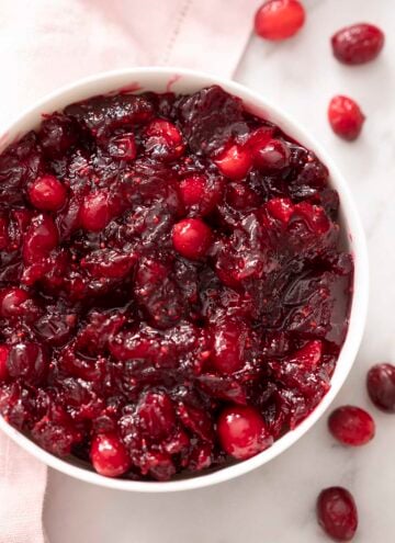 A white bowl filled with homemade cranberry sauce.