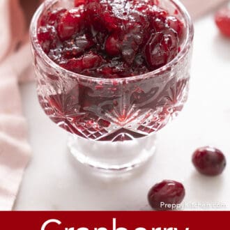 cranberry sauce in a footed glass bowl