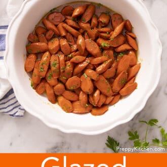 glazed carrots in a white serving dish
