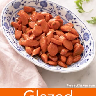 glazed carrots in a blue and white dish
