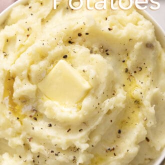 Pinterest graphic of mashed potatoes in a bowl topped with butter and pepper.