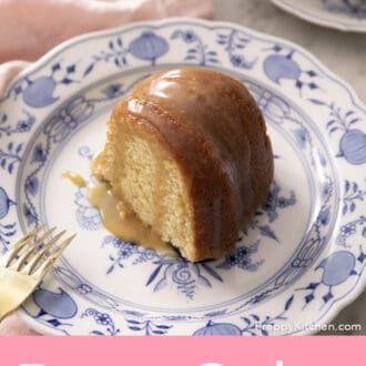 Piece of rum cake sitting on a blue and white plate