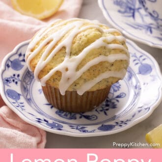 A lemon poppy seed muffin with lemon icing on a blue and white plate.