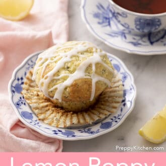 a lemon poppy seed muffin unwrapped on a blue and white plate