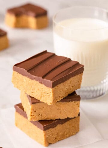 A stack of peanut butter bars on a marble surface.