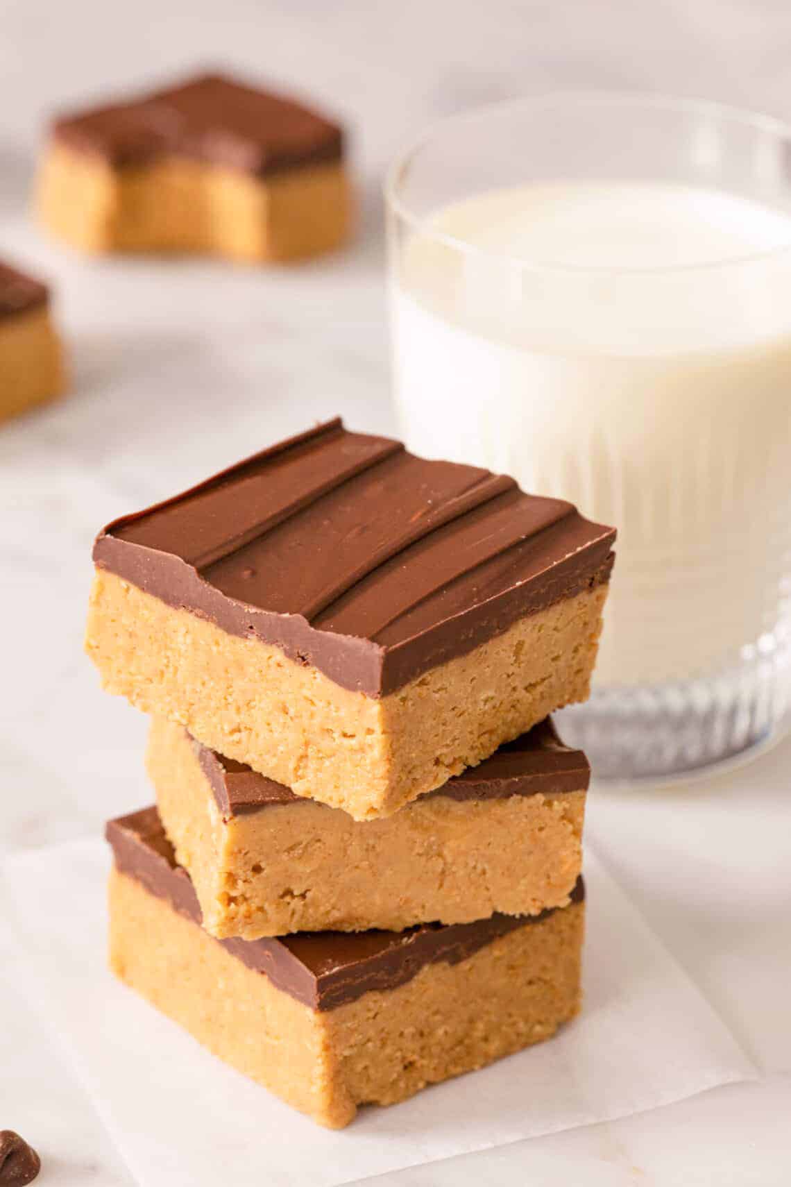 A stack of peanut butter bars on a marble surface.