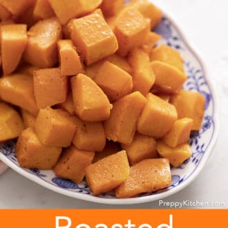 cubed roasted butternut squash in a blue and white platter