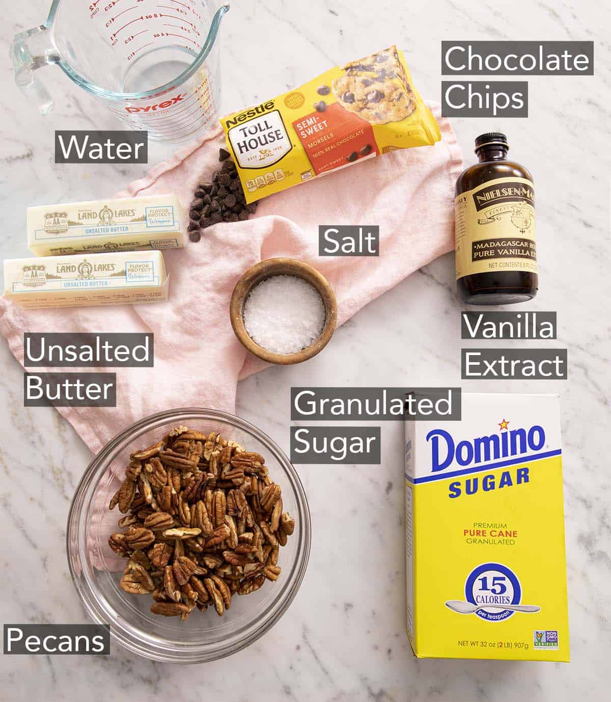 Ingredients to make toffee on a marble counter.