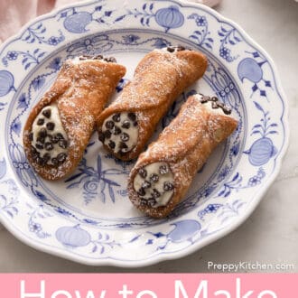 3 cannoli on a blue and white plate