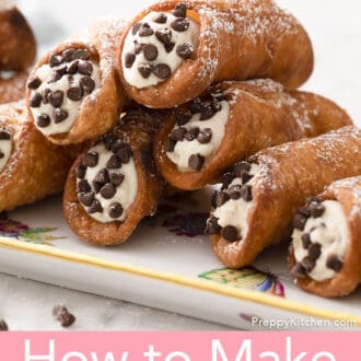 close up of cannoli stacked on a floral tray