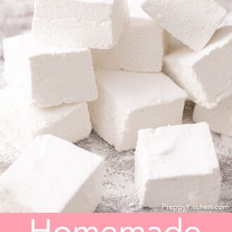 several cubed marshmallows stacked on a cutting board