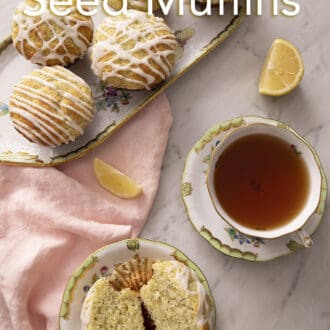 lemon poppy seed muffins on a floral tray with a cup of tea