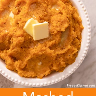 A big serving bowl full of homemade mashed sweet potatoes.