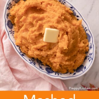 Mashed sweet potatoes with butter in a blue and white serving dish