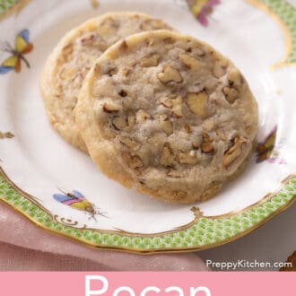 closeup image of pecan sandies stacked on a plate