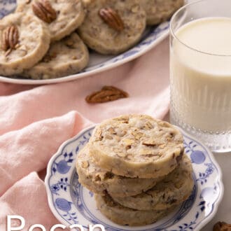 pecan sandies stacked on a blue and white plate