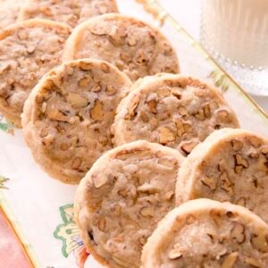Pecan sandies arranged on a porcelain platter.