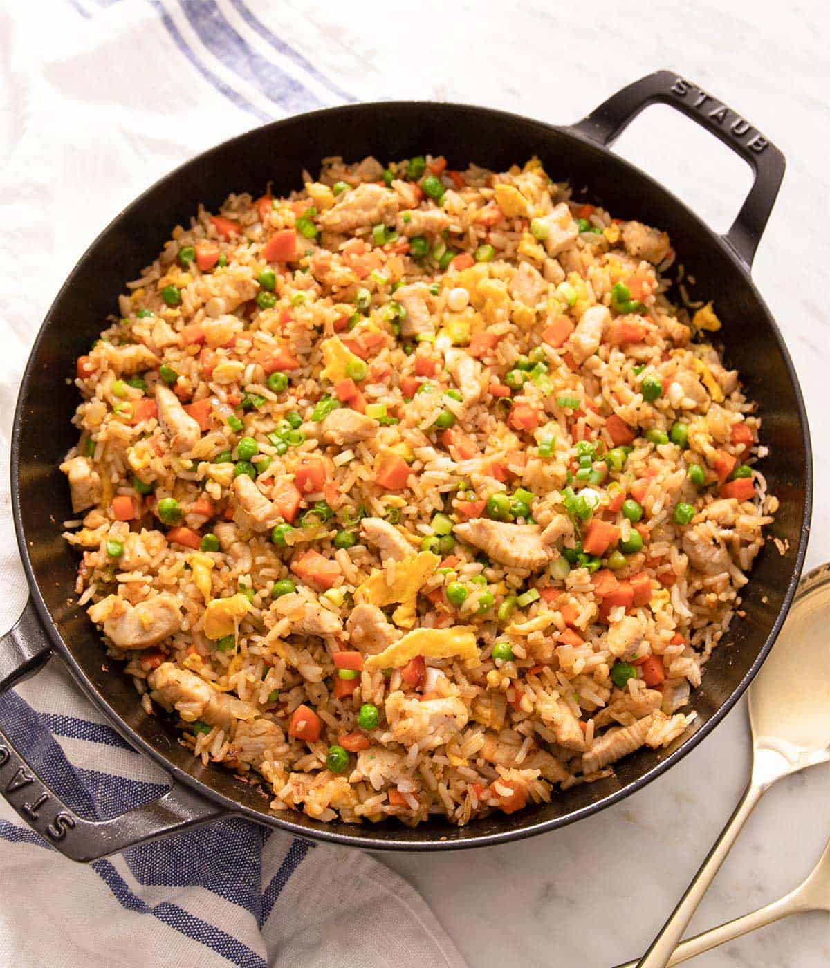 An overhead shot of chicken fried rice in a skillet