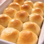 A close up of dinner rolls in a baking dish