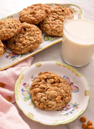 Oatmeal scotchies on plates with a glass of milk