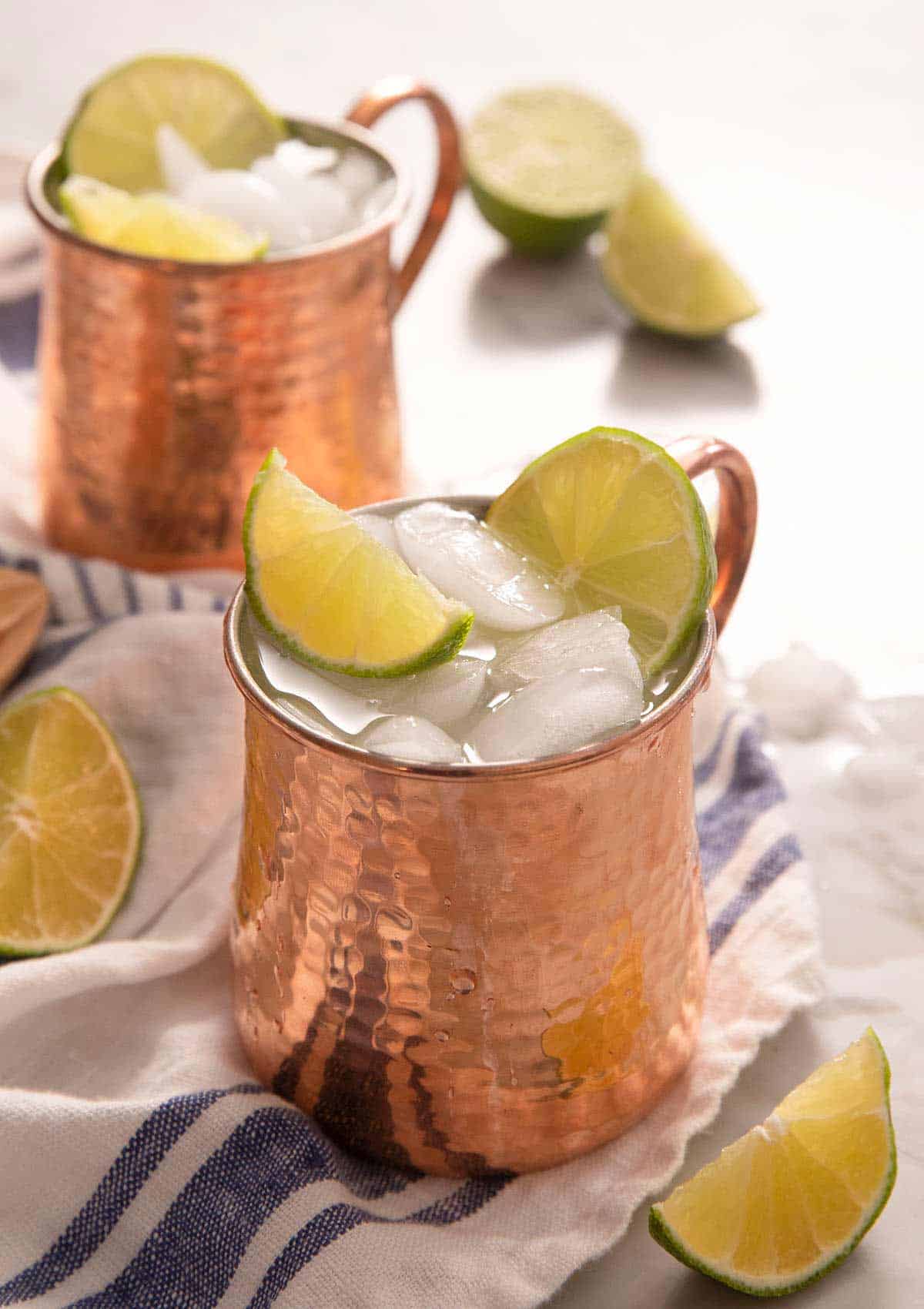 A side shot of a Moscow Mule cocktail in a copper mug