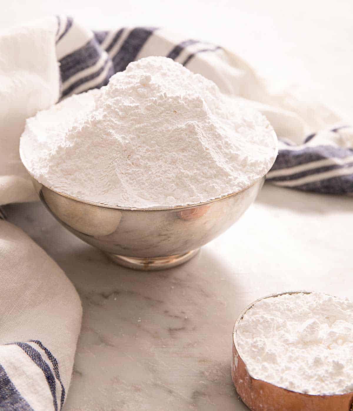 Powdered sugar piled up high in a small bowl