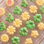 A close up of spritz cookies on a cooling rack