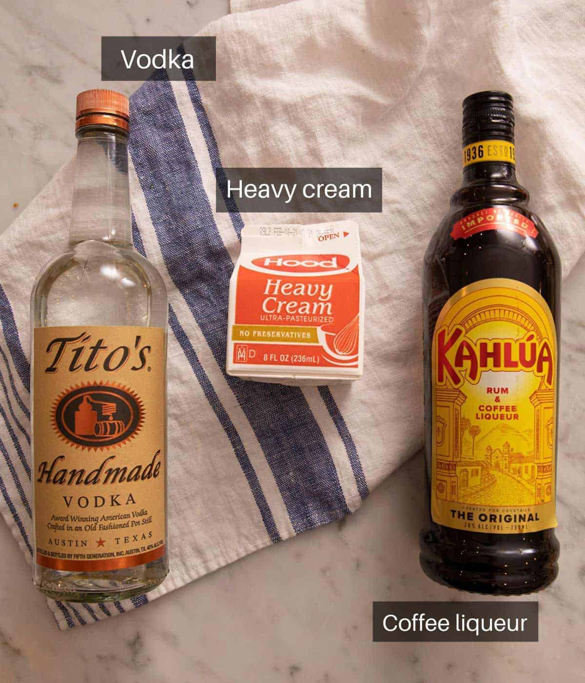 An overhead shot of all the ingredients you need to make a White Russian cocktail