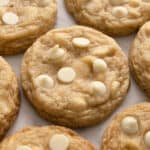 A close up of white chocolate chip cookies