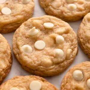 A close up of white chocolate chip cookies