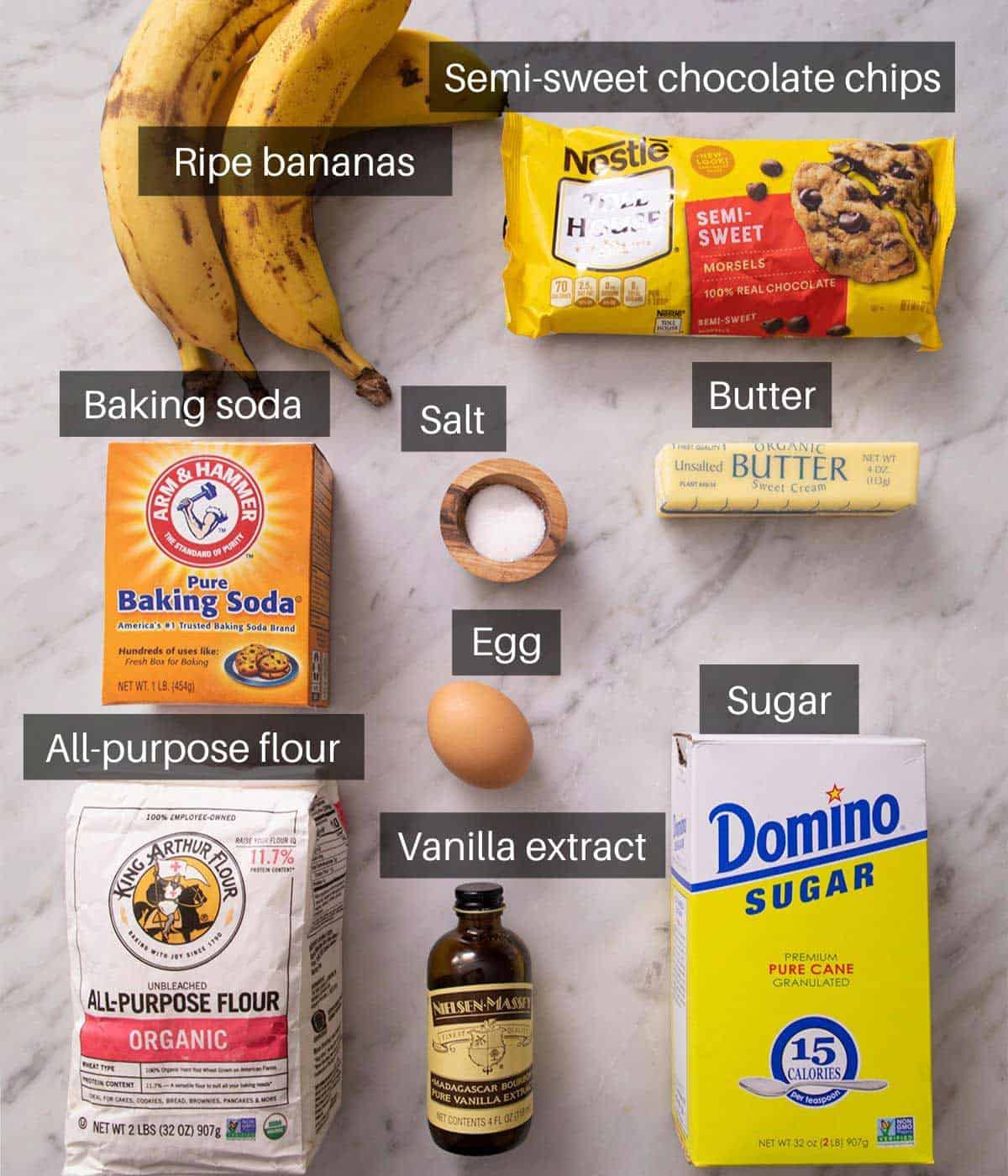 An overhead shot of all the ingredients you need to make banana chocolate chip muffins
