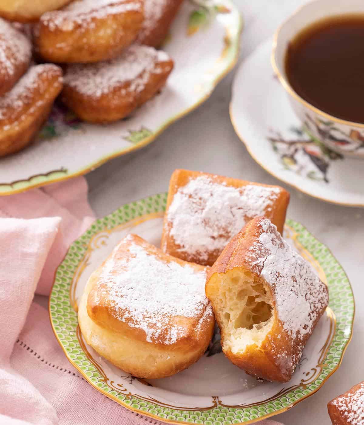 Three Beignets on a china plate