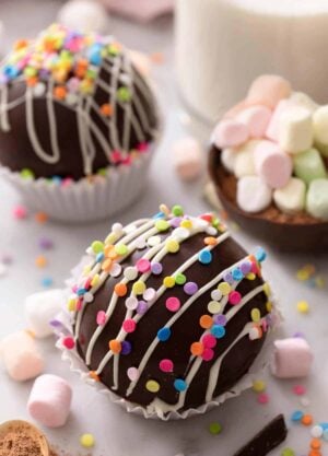 A hot chocolate bomb topped with sprinkles