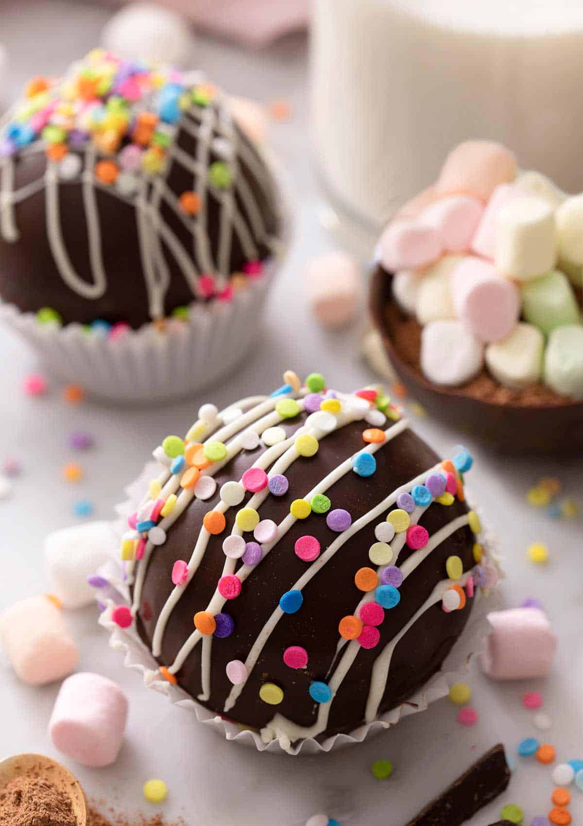 A hot chocolate bomb topped with sprinkles