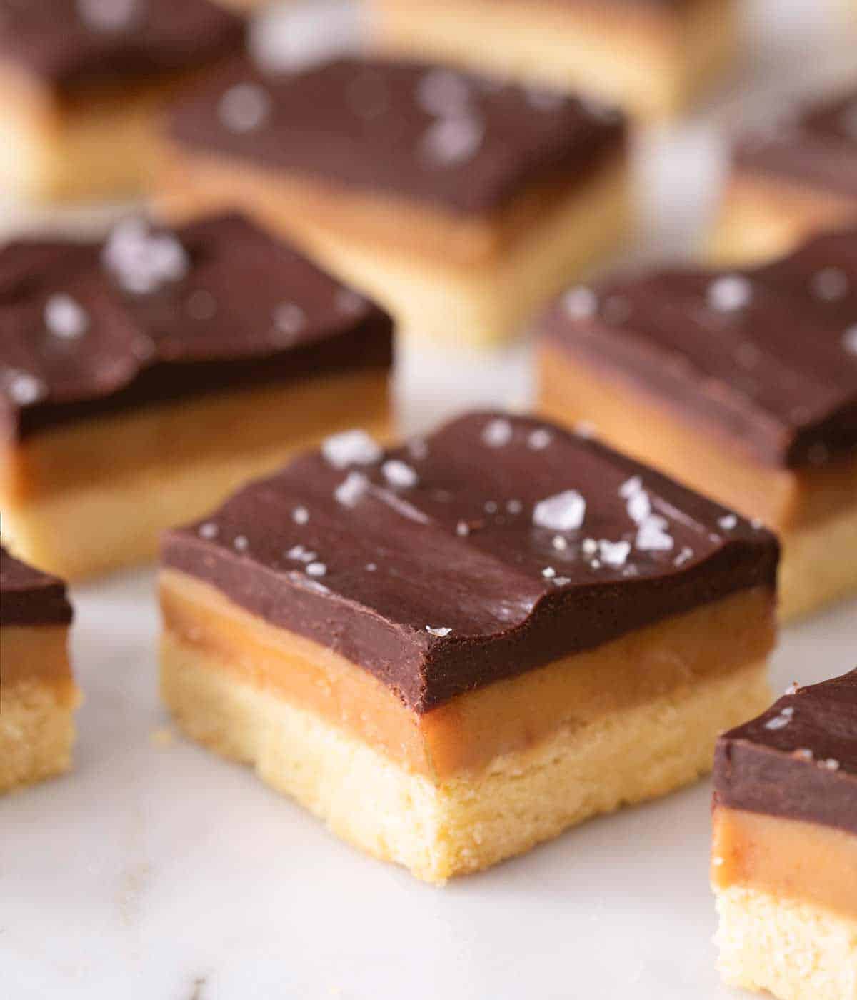 A close up of Millionaire's shortbread on a marble work surface