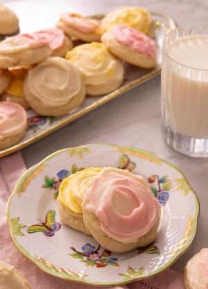 Two sour cream cookies on a china plate