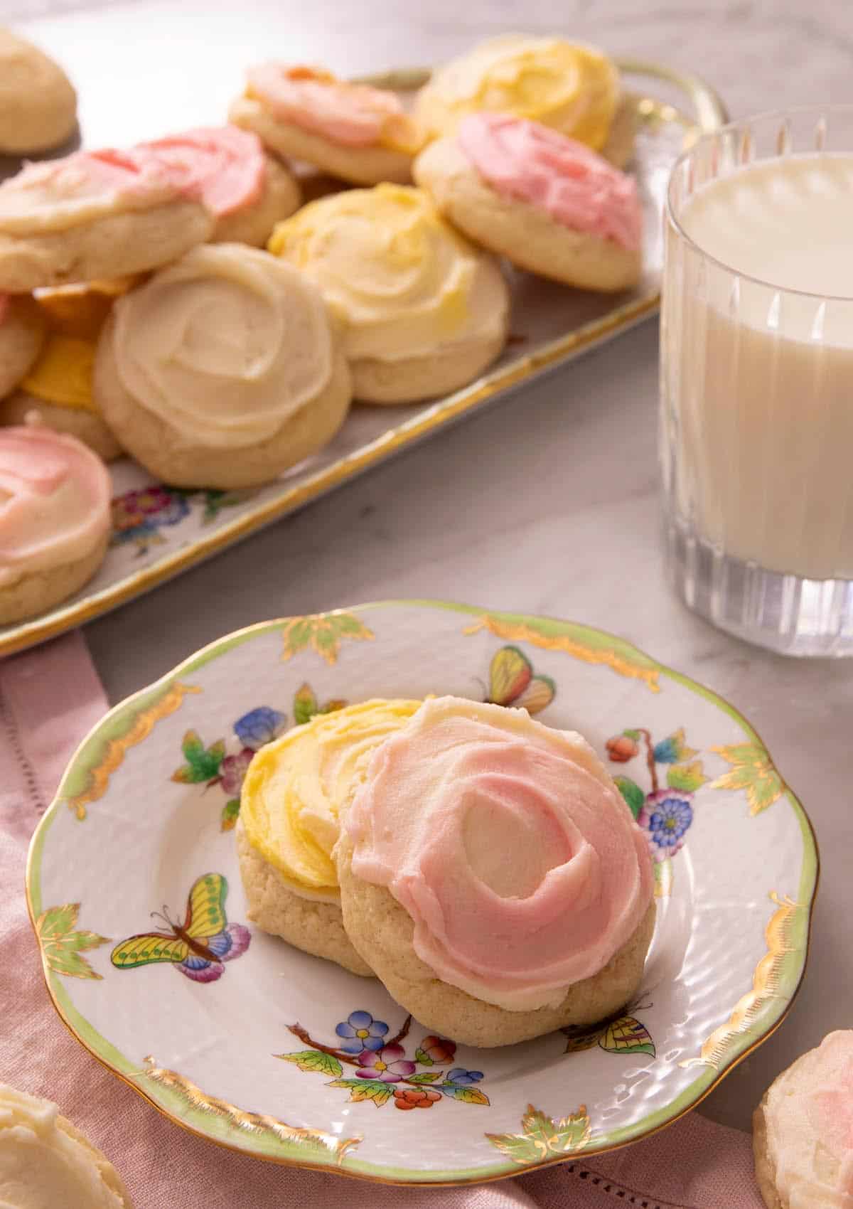 Two sour cream cookies on a china plate