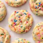 Close up of a funfetti cookie on a marble surface.