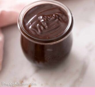Pinterest graphic of a weck jar filled with hot fudge by a pink linen.