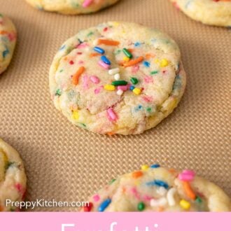 Pinterest graphic of funfetti cookies cooling on a silicone mat.