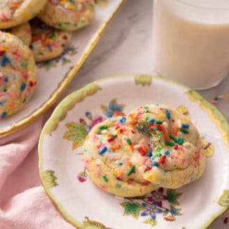 Pinterest graphic of a plate and a platter of funfetti cookies by a pink linen.