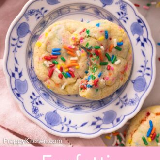 Pinterest graphic of two funfetti cookies in a blue and white plate.