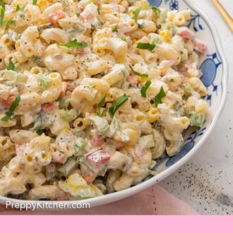 A Pinterest graphic of a bowl of macaroni salad beside a gold spoon.