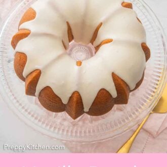 Pinterest graphic of an overhead view of a glazed vanilla Bundt cake on a glass cake stand on top of a pink linen napkin.