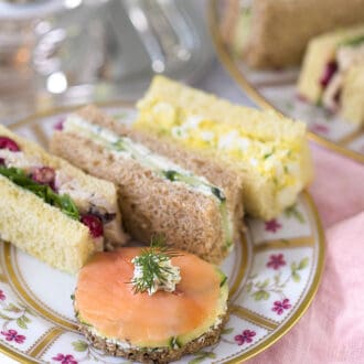 English tea sandwiches sitting on a floral plate