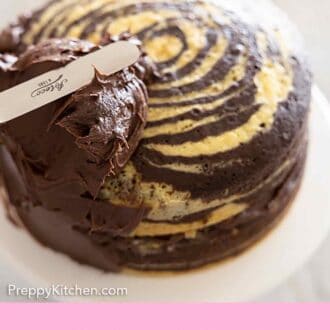 Pinterest graphic of chocolate frosting being spread onto a cake.