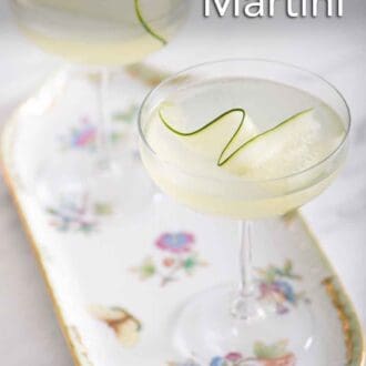 Pinterest graphic of two cucumber martinis on a floral tray.