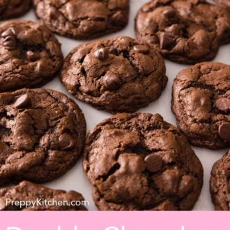 Pinterest graphic of a single layer of double chocolate chip cookies on a counter.